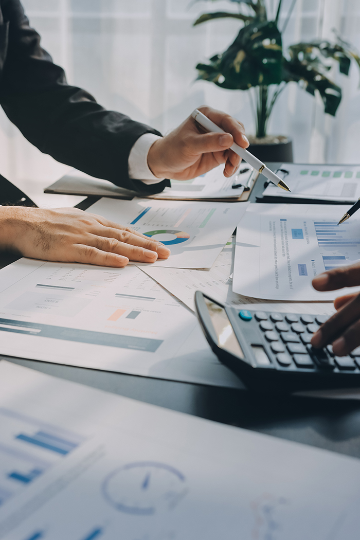 Accounting company provide finance and taxation planning for profitable cash flow, Auditor and accountant team working in office, analyze financial data and accounting record with calculator.Insight